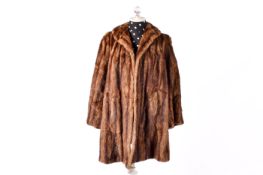 A vintage brown ladies fur coat with coloar and brown lining.