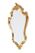 A 20th century Rococo style ornate giltwood wall mirror.