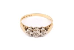 An 18ct gold three-stone ring.