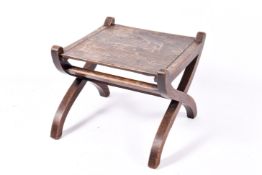 An oak Jacobean style X frame coffee table.