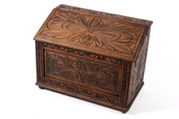 Carved oak fire side log or coal box with metal liners.