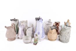 A quantity of mostly 19th Century English pottery jugs. Including W. B. & Son 'Cupid', etc.