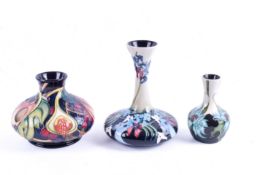 Three small modern Moorcroft vases, circa 2000s. Including 'Sea Holly', 'Queen's Choice', etc.