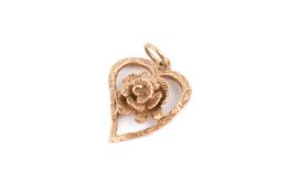 A 9ct gold heart pendant. Set with a central flower, hallmarked, height circa 1.8cm, weight 1.9g.