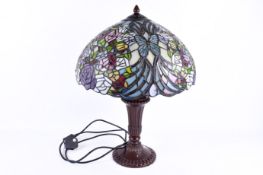 A 'Tiffany' style table lamp, with leaded stained glass shade.
