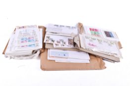 A collection of assorted first day covers and stamp related postcards.