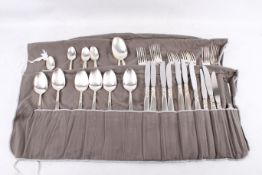 A quantity of Community silver plate flatware in two cloth rolls.