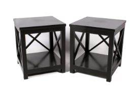 A pair of contemporary black side tables with X-shaped side frames and a lower shelf.