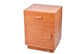 A mid-century oak bedside cabinet.