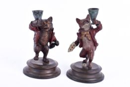 A pair of cold painted spelter figures, modelled a fox and a bear. Raised on circular bases. H17.