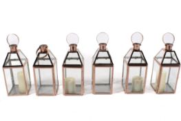 A group of six contemporary copper effect lanterns, H42cm,