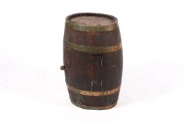 A vintage oval shaped barrel with brass straps and later converted with door to the front.