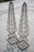Two ornamental wire work garden obelisk frames.
