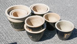 A group of ten garden pot with decorative black,