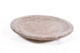 A large sculptural hardwood bowl, likely teak, on a triple stepped base.