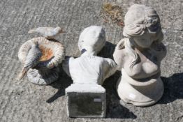 Two reconstituted stone garden ornaments in the form of female busts.