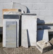 A quantity of assorted marble slabs, mostly tops from washstands.