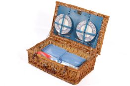 A 20th century Optima wicker picnic basket with picnic set contents.