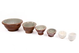 Group of six graduated ceramic jelly moulds.