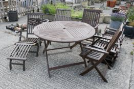 A hardwood suite of garden furniture.