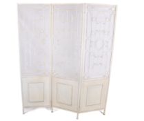 A contemporary three-section folding metal screen painted cream. Having open metal work decoration.