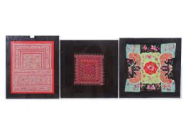 Three framed Chinese Miao tribal embroidered panels, including a baby carrier.