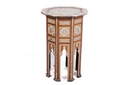 A Persian bone and mother of pearl inlaid side table. Octagonal top above Moorish arched supports.