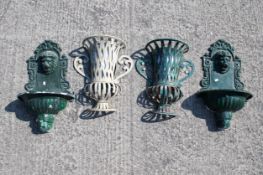 Two pairs of metal wall planters.