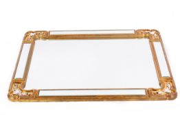 A contemporary gilt framed wall mirror having bevel edge margin mirrors.