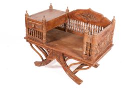 An Indian 20th century carved hardwood elephant saddle / Howdah chair.
