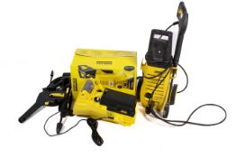 A new Karcher K2.950 pressure washer in box along with another used K2.950 pressure washer.