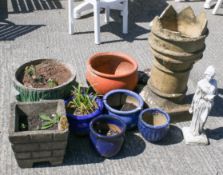 A group of garden planters and a chimney. Including blue glazed pots and a terracotta example.