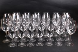 A group of twenty-eight Riedel crystal wine glasses of various sizes.