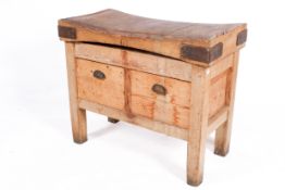 A small butcher's block with two drawers.