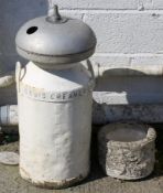 A vintage Totnes milk churn labelled for Davis Creameries along with a milk cooler and a small