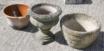 Two assorted reconstituted stone garden planters and a terracotta bowl.
