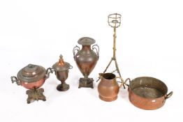 A group of seven assorted brass and copper items. Including a pitcher and a saucepan, etc.