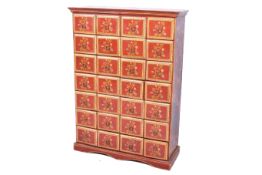 An Indian style bank of drawers with painted decoration.