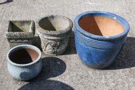 Four assorted garden planters.