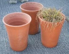 Three large terracotta flower pots by Yorkshire Flowerpots