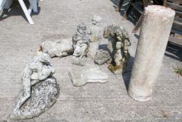A group of six reconstituted stone garden figures and a cylindrical plinth.