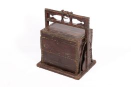 A wooden Chinese stacking wedding chest. Bound with metal and stud work.