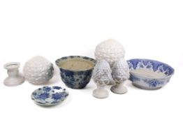 A group of assorted decorative ceramic items. Including a pair of white pineapple finials, etc.