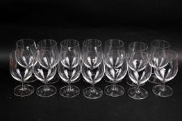 A set of fourteen Riedel stemmed water glasses.