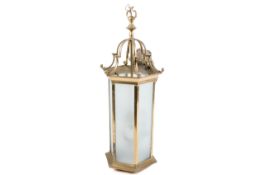 A hexagonal brass hall lantern ceiling light.