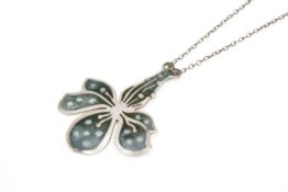 A Norman Grant Scottish silver flower form pendant.