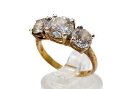 A gold plated and cubic zirconia dress. With three round cut stones, size Q, gross weight 4.2g.