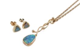 An opal pendant and pair of earrings.