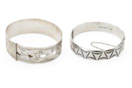 Two silver bangles. One in the form of a belt, both hallmarked, gross weight 54.8g.
