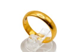 A 22ct yellow gold wedding band. Hallmarked, width of band 4mm, size N, weight 6.5g.